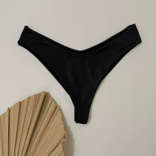 Load image into Gallery viewer, Black bikini bottom on a light background