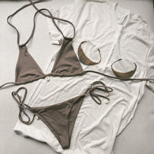 Load image into Gallery viewer, Brown bikini set on top of an off white oversized beach tee with two coconuts on the front of it

